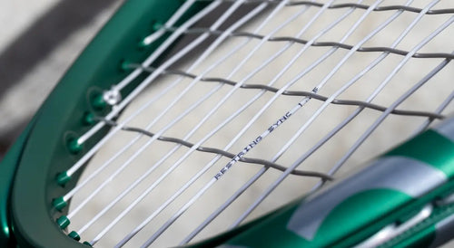 close up of restring sync tennis string in tennis racket showcasing both mains and crosses at a tension differential