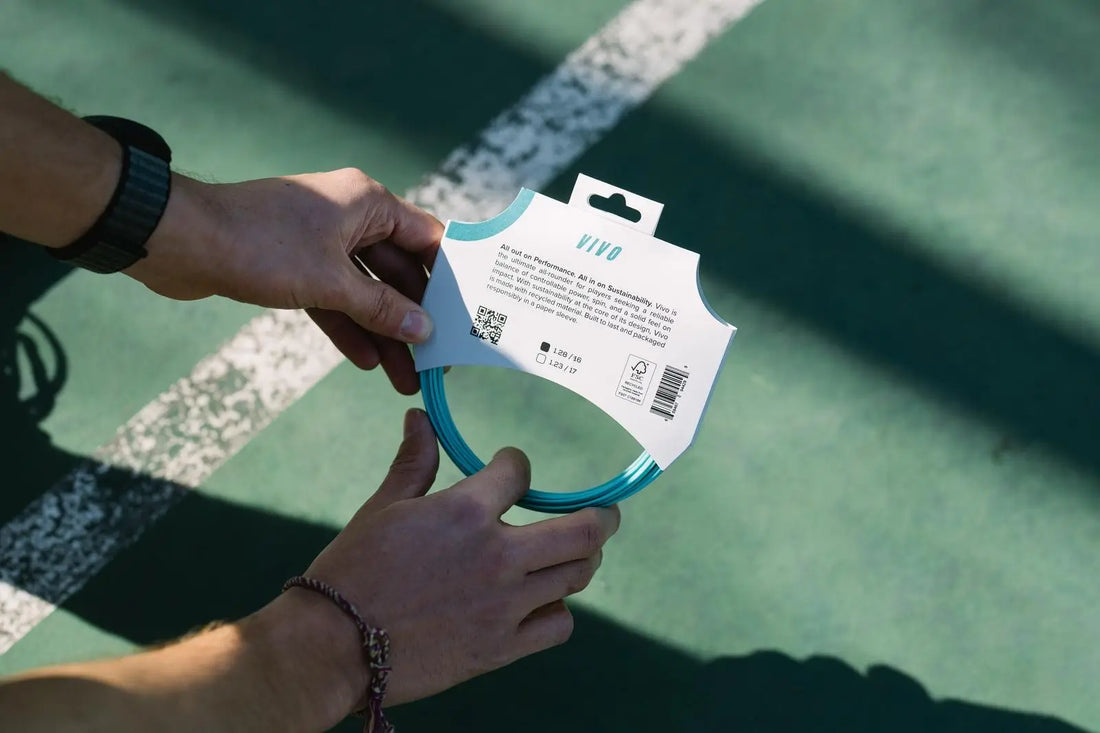 man holding restring vivo string in its packaging